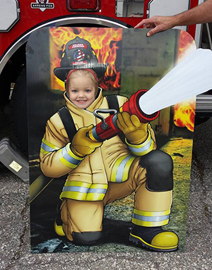 Girl in a firefighter costume